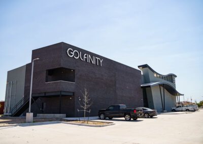 A modern building and a car parked in front of it